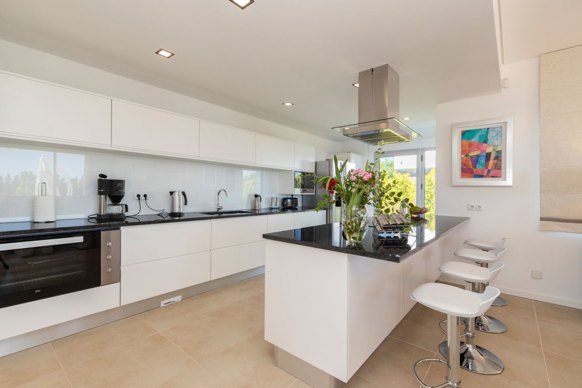 The kitchen is modern and with top of the range appliances